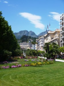 looking north past the Jardins Biovès towards the Belle Epoque Winter Palace, with the perched village of Sainte-Agnès looming in the distance