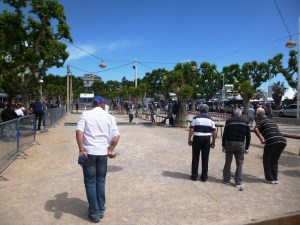 Locals playing pétanque on Place de l'Etang, just opposite the waterfront and the Old Port 