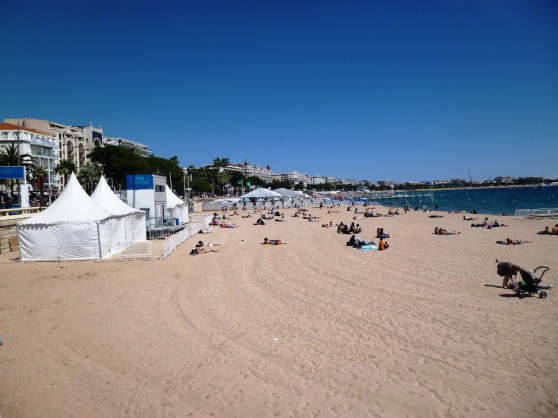 The stunning sandy beach of Cannes, just underneath the Croisette promenade